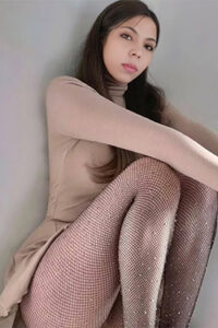 Marisa Escort Berlin sensual slender beauty seduces during a secret flirt with delicate foot eroticism